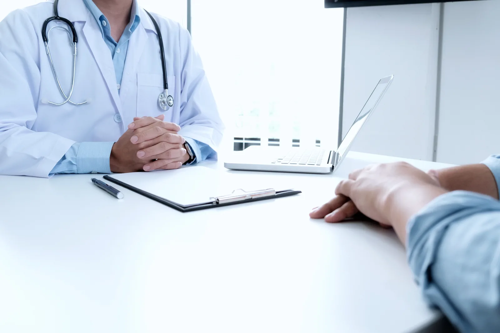 Physician reviewing a patient case at the clinic