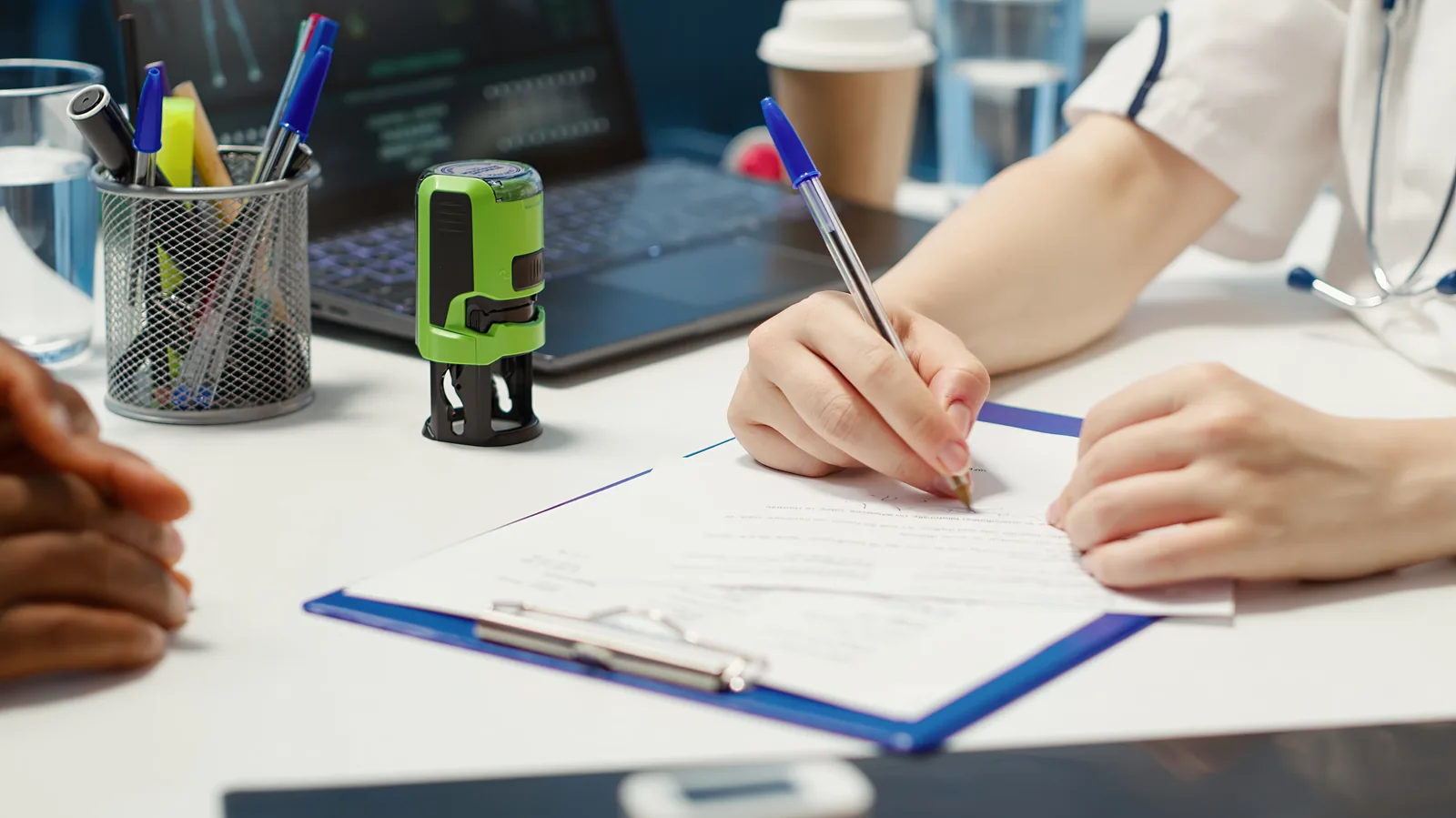 Physician completing official patient documentation